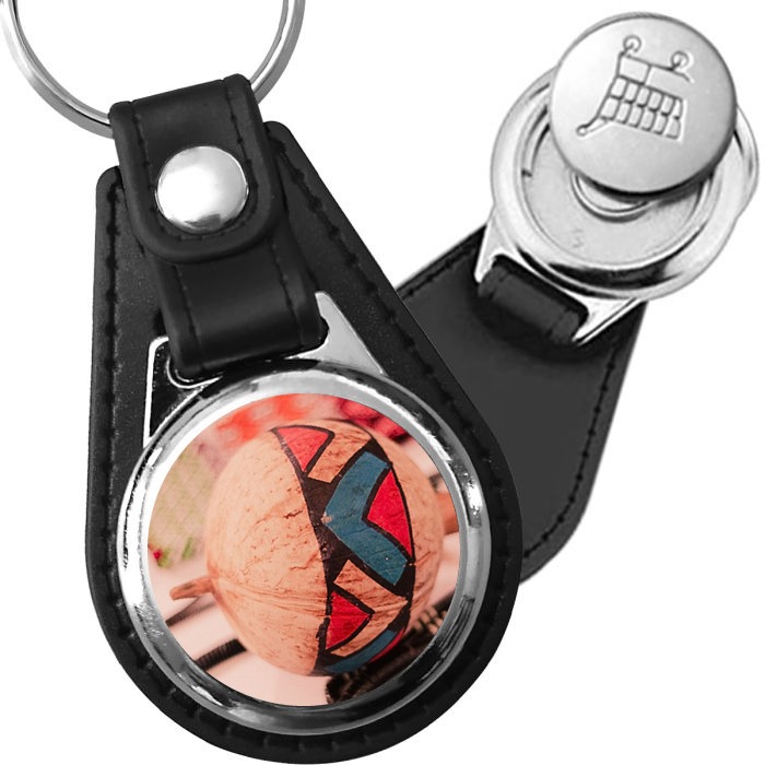 Porte-clé cuir avec médaillon instrument Maracas